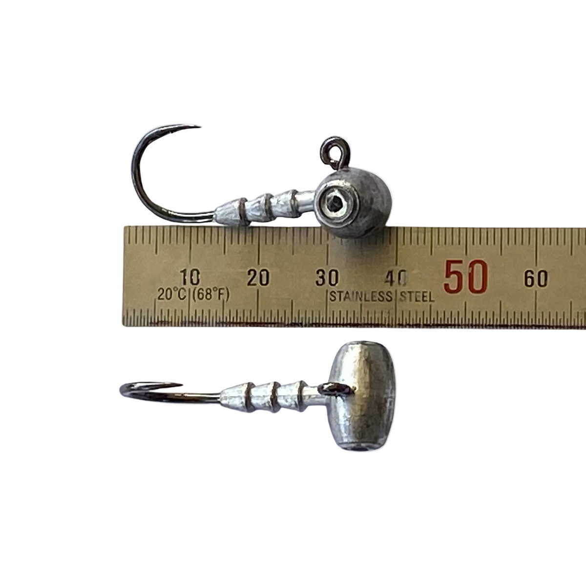 Very small strong jig head hooks shown with ruler