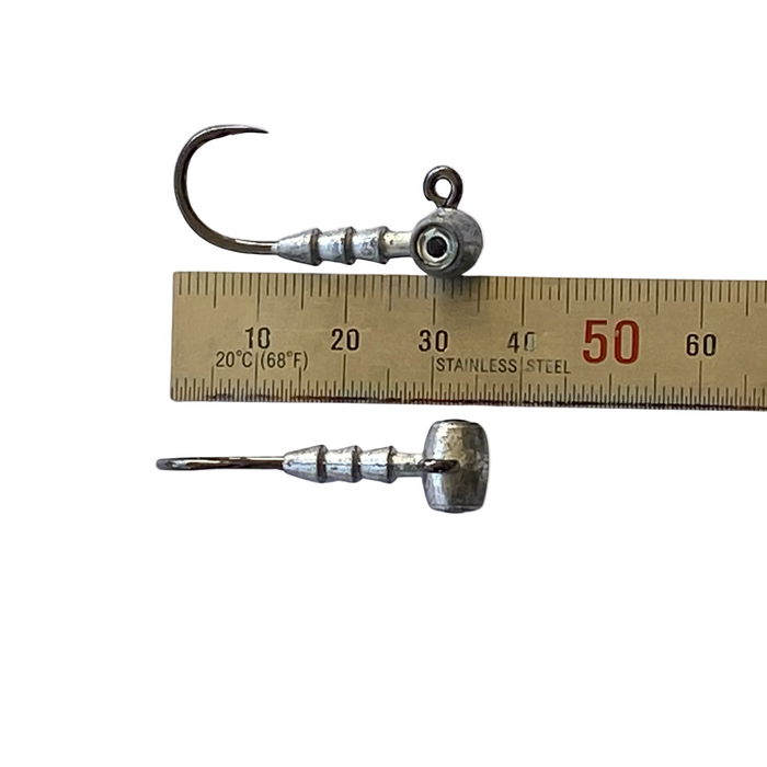 Very small strong jig head hooks shown with ruler