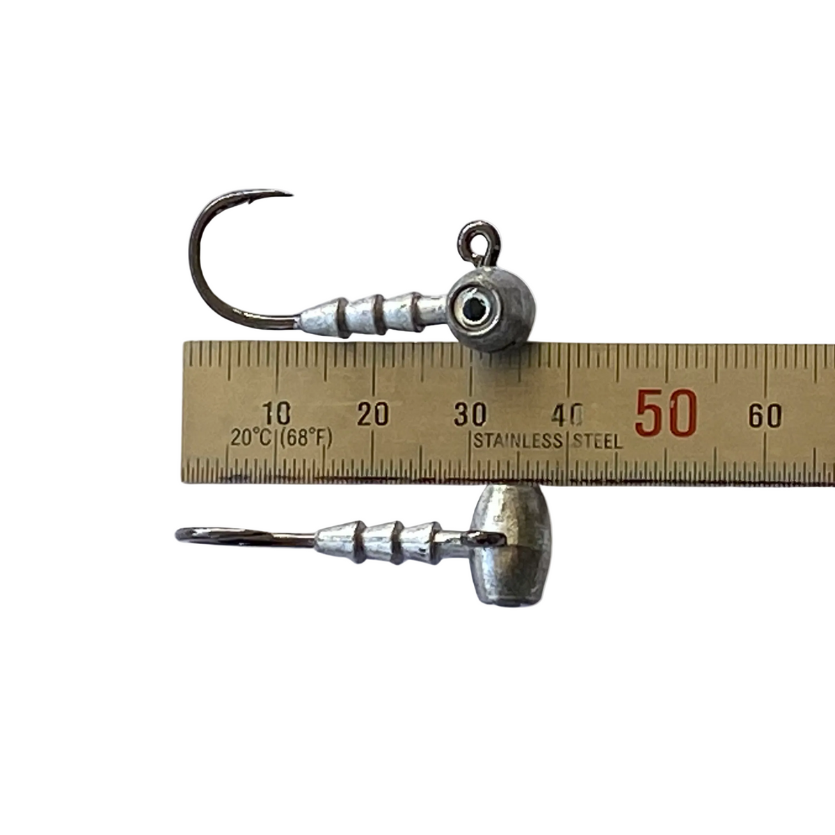 Very small strong jig head hooks shown with ruler