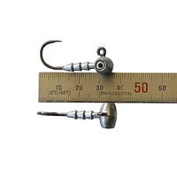 Very small strong jig head hooks shown with ruler